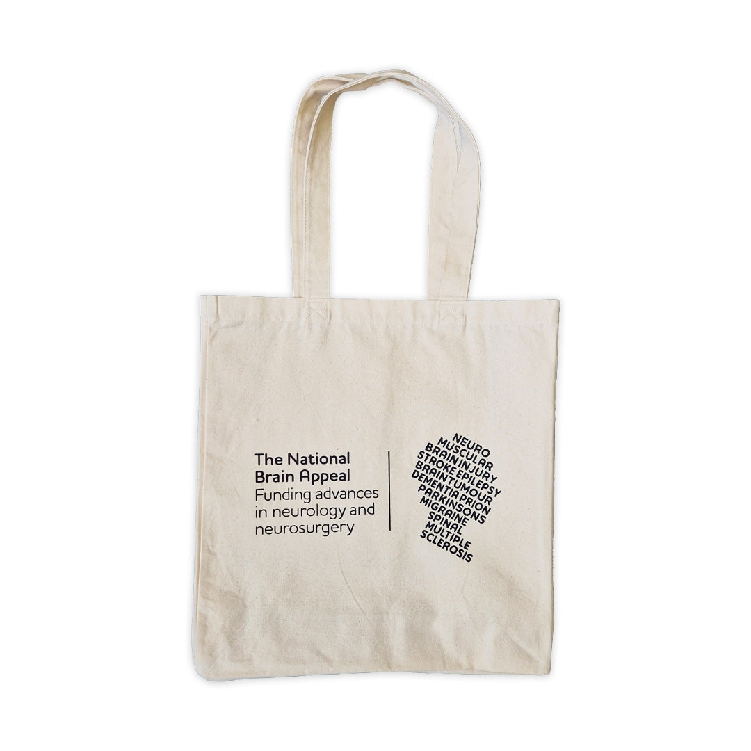 Beige tote bag with The National Brain Appeal on a white background